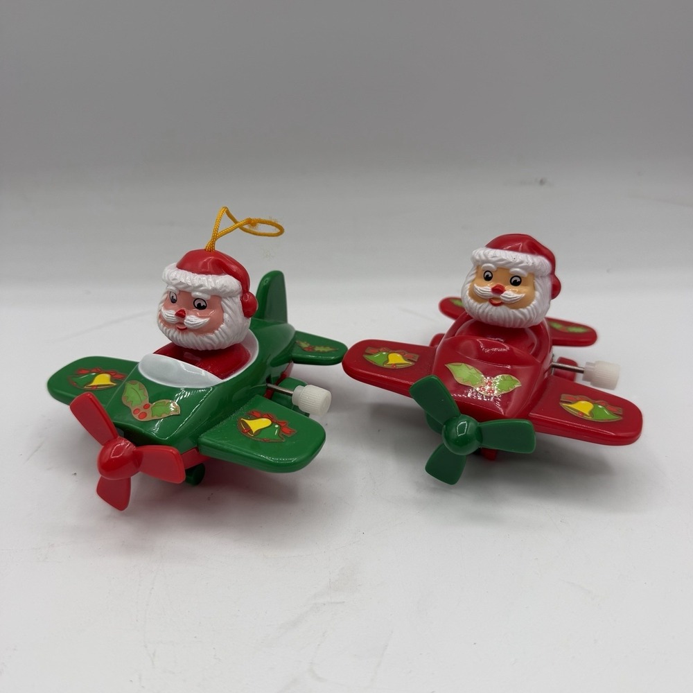Pair of Vintage Wind Up Santa Claus Air Plane Christmas Ornaments Plastic